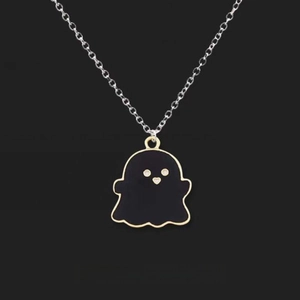 Minimalist black ghost pendant necklace with gold trim and heart eyes on silver chain