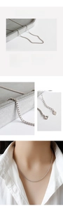 Macro detail of S925 sterling silver curb chain necklace with lobster clasp and hallmark