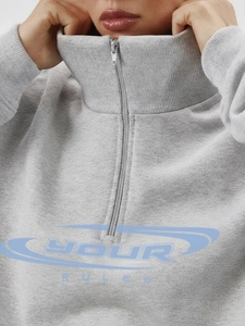 Light gray half-zip sweatshirt with YOUR RULES print and high neck athletic design
