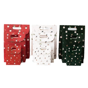 Christmas gift bags set in red white and green with Santa and reindeer cartoon patterns