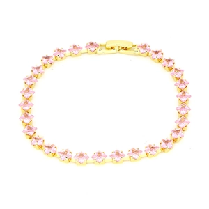 Detailed macro shot of 18k gold-plated tennis bracelet with pink square-cut zircons