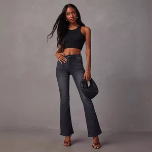Women's trendy outfit with black cropped tank top and dark grey flare denim jeans
