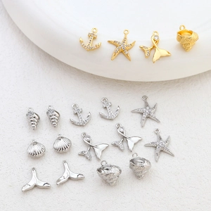 Gold and silver ocean charms set with anchor starfish and whale tail for DIY jewelry
