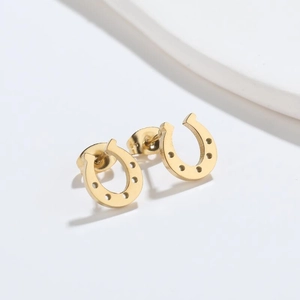 Lucky horseshoe stud earrings in gold-tone stainless steel with hollow U-shape design