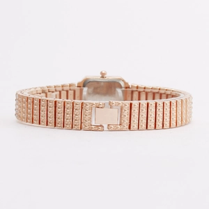 Rose gold square watch for women featuring a textured metal band and secure fold-over clasp