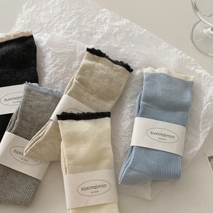 Five pairs of rib-knit crew socks with scalloped edges in assorted pastel colors