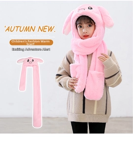 Detailed close-up of pink faux fur rabbit ear hat scarf with integrated glove pockets