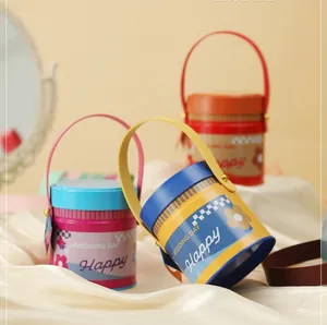 Detailed view of colorful tin buckets with metal handles for wedding candy gift packaging