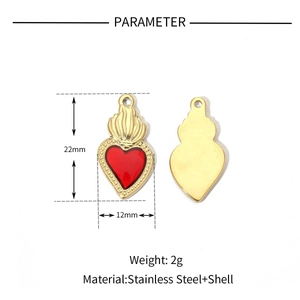 Detailed view of 22x12mm gold stainless steel heart pendant with red inlay and flame top
