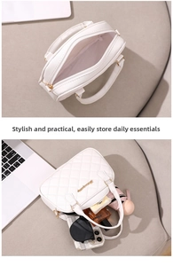 Internal capacity of white quilted handbag showing phone, sunglasses and cosmetics
