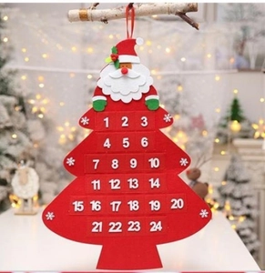 Detail of red felt Christmas tree advent calendar with Santa head and numbered gift pockets