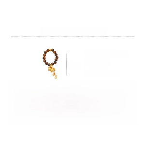 Macro shot of tiger eye bead ring with copper horse charm and dimension specifications