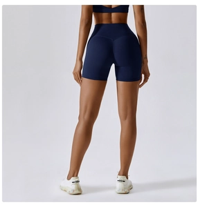 Rear view of high-waist navy yoga shorts with V-shaped stitching for a lifting effect