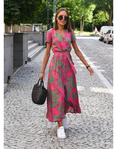 Close-up of V-neck floral midi dress with green and pink patterns and waist tie