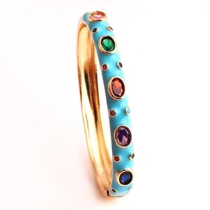 Detail view of gold-plated bangle with sky blue enamel and colorful zircon inlay stones
