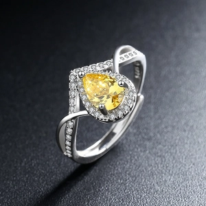 Elegant 925 silver open ring with pear-cut yellow zircon and sparkling side stones