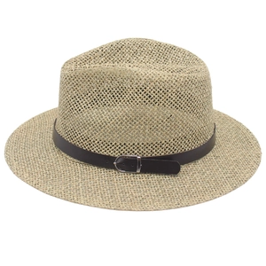 Classic straw fedora hat with brown leather belt and silver buckle on white background
