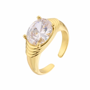 Detail of adjustable gold ring featuring an oval cubic zirconia with ribbed band