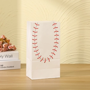 Detail of white kraft gift bag featuring red and black baseball stitching pattern