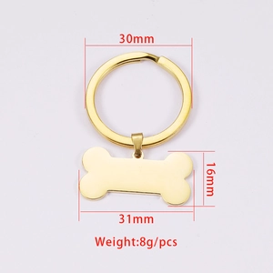 Dettaglio del pendente a forma di osso dorato con anello da 30mm e misure del prodotto