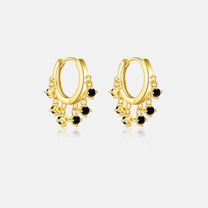 Detail of S925 sterling silver hoop earrings with black zircon pendant and gold plating