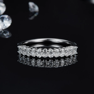 Elegant 925 sterling silver moissanite ring with oval cut stones on black mirror
