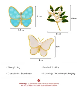 Detailed size chart for butterfly and flower brooches with exact dimensions in cm