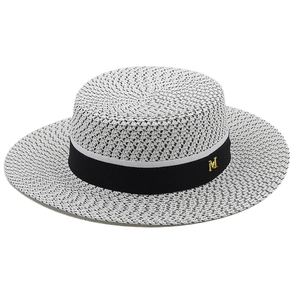 Flat top boater straw hat in black and white weave with black ribbon and golden M charm