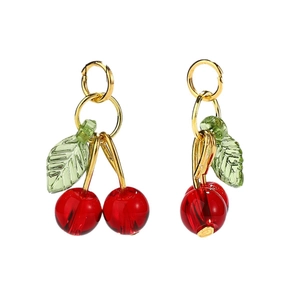 Stereo cherry charm earrings with red fruit and green leaves on a white background