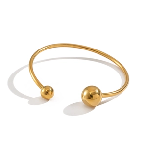 Minimalist 18K gold-plated stainless steel open cuff bracelet with dual polished metal spheres