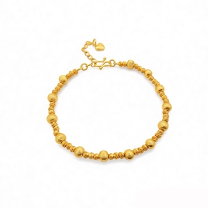 24k gold-plated beaded bracelet featuring matte round beads and heart pendant on white background