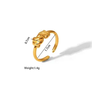 Macro shot of gold twist knot adjustable stainless steel ring with 1.7cm inner diameter