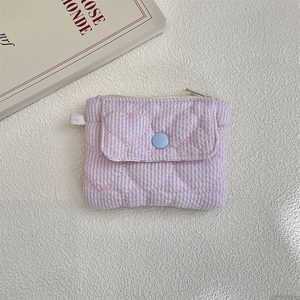 Detail of purple striped mini wallet with heart quilting and light blue snap button