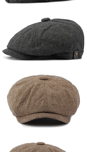 Close-up of vintage newsboy caps in dark grey and brown tweed with metal buckle details