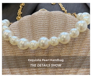 Detailed close-up of golden sequin shell bag featuring elegant pearl bead handle and chain
