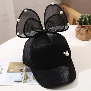 Detail of black girl's baseball cap with tulle ears and pearl Mickey silhouette accents