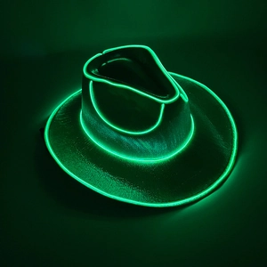 Detail of neon green LED glowing edges on a black leather cowboy party hat in the dark