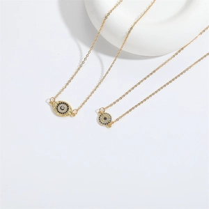 Golden choker necklace with evil eye teardrop pendant and sparkling rhinestones