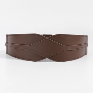 Detail of dark brown leather wide belt with overlapping geometric design and fine stitching