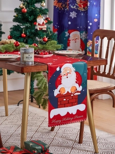 Detail of red Christmas table runner with Santa Claus pattern and Happy Holidays text