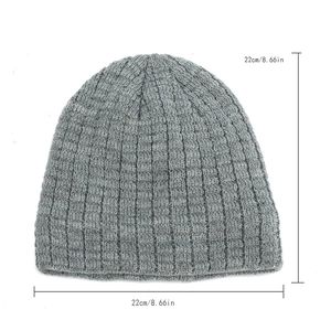 Close-up of grey ribbed knit beanie showing stretch material and 22cm size dimensions