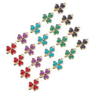 Detailed close-up of colorful alloy clover charms with glossy oil dripping finish