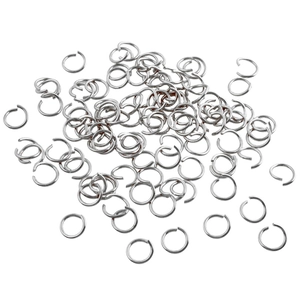 Macro shot of loose silver metal jump rings for DIY jewelry making and necklaces