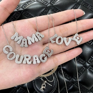 Silver letter pendants MAMA LOVE COURAGE with pavé zircons on black quilted leather
