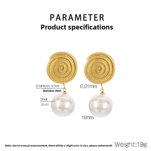 Detail view of spiral gold stainless steel earrings with 16mm white shell pearl