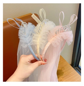Three princess headbands with lace veils and rhinestones in blue, beige, and pink