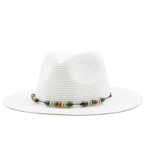 Detailed close-up of white Panama straw hat featuring colorful wooden beads decoration