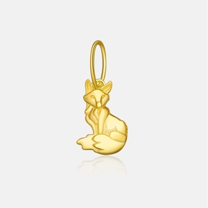 Macro shot of a detailed golden fox pendant with a polished metallic finish on white back