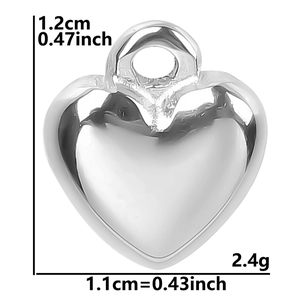 Detail view of silver heart pendant showing 1.2cm height and 1.1cm width dimensions