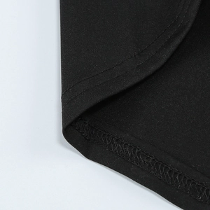 Detailed close-up of double-stitched hem and fabric texture of a black fishtail evening dress